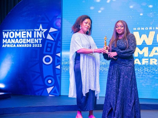 Motunrayo Babalola receiving an award on stage at the Women in Management Africa Awards 2023