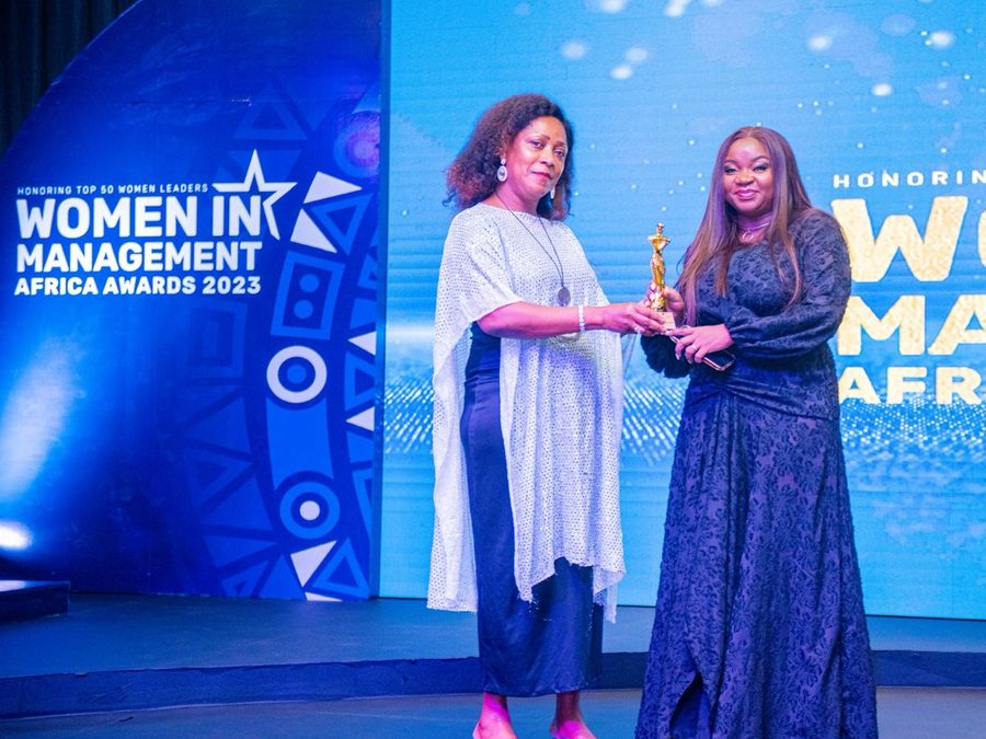 Motunrayo Babalola receiving an award on stage at the Women in Management Africa Awards 2023